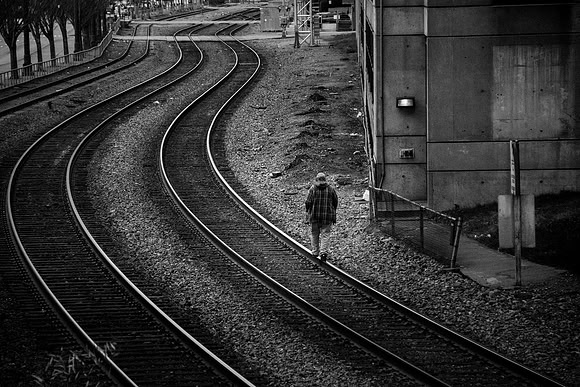 Homeless Man On Train Tracks
